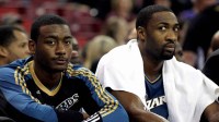 Wizards guard John Wall sits with Gilbert Arenas