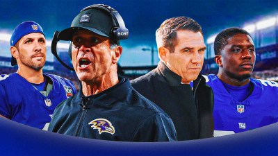 Giants HC John Harbaugh and Giants GM Joe Schoen (both in front). Giants K Graham Gano and Giants RB Devin Singletary behind them with New York Giants logo in background