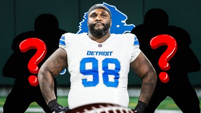 Lions DT D.J. Reader with two silhouettes of American football players with big question mark emojis inside. There is also a logo for the Detroit Lions.