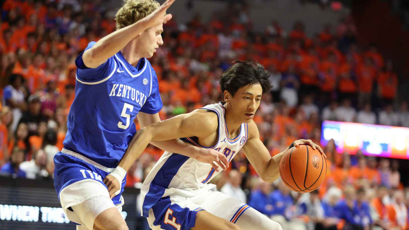 Florida guard Xaivian Lee (1) drives past Kentucky guard Collin Chandler (5) during the first half of a NCAA mens basketball game at Steven C. O'Connell Center Exactek arena in Gainesville, FL on Saturday, February 14, 2026.