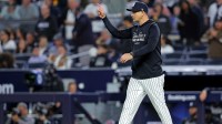 New York Yankees manager Aaron Boone signals to the bullpen during the seventh inning against the Toronto Blue Jays during game four of the ALDS round for the 2025 MLB playoffs at Yankee Stadium.