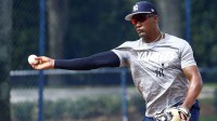 Yankees third baseman Miguel Andujar (41) throws to first base