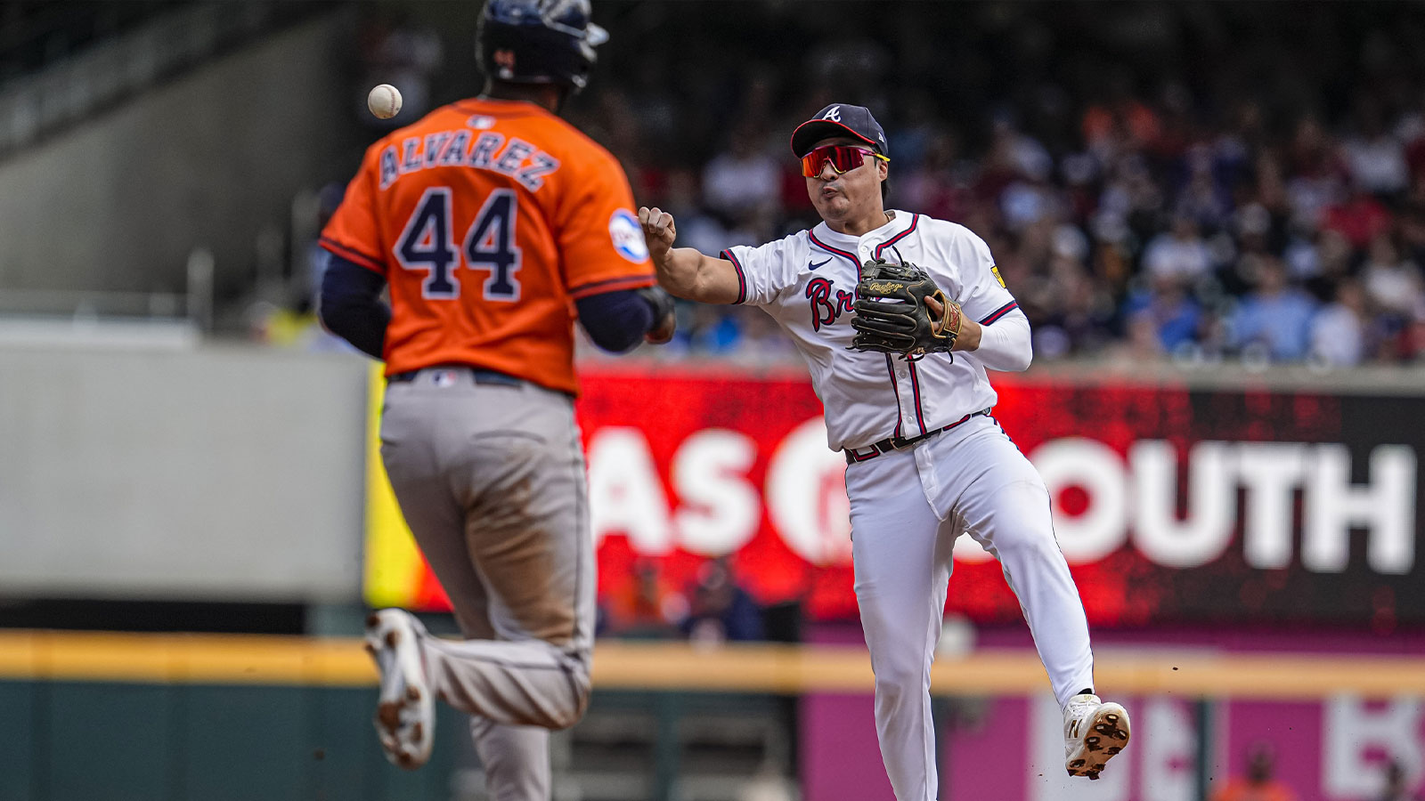 Atlanta Braves shortstop Ha-Seong Kim (9) throws for a double play after forcing out Houston Astros left fielder Yordan Alvarez (44) during the third inning at Truist Park.