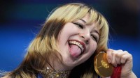 Alysa Liu of the United States celebrates with the gold medal in the women's free skate during the Milano Cortina 2026 Olympic Winter Games at Milano Ice Skating Arena.