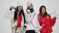 From left Chloe Kim of the United States, Gaon Choi of the Republic of Korea and Mitsuki Ono of Japan on the podium after the women's halfpipe final during the Milano Cortina 2026 Olympic Winter Games at Livigno Snow Park.