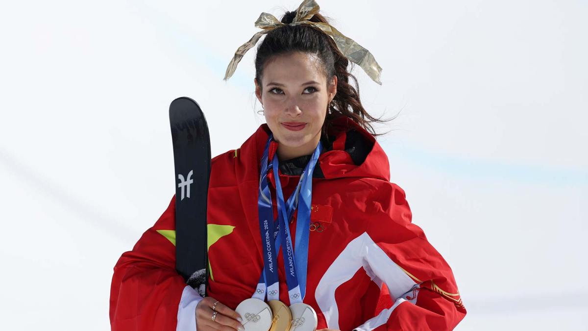 Gold medalist Ailing Eileen Gu of the People's Republic of China poses for a photo with her three medals after the medal ceremony for the women's skiing halfpipe during the Milano Cortina 2026 Olympic Winter Games at Livigno Snow Park.