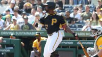 Pittsburgh Pirates designated hitter Andrew McCutchen (22) hits an RBI single against the Athletics during the first inning at PNC Park.
