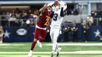 Dallas Cowboys wide receiver George Pickens (3) makes a reception defended by Washington Commanders cornerback Marshon Lattimore (2) during the second quarter of the game at AT&T Stadium.