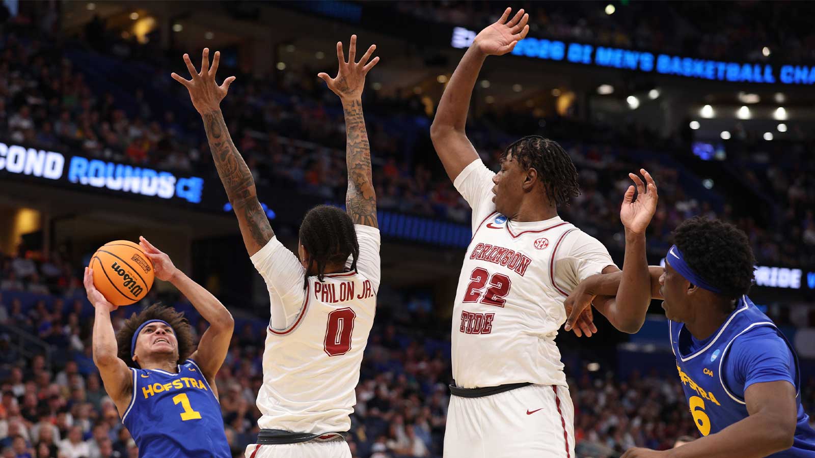 Hofstra Pride guard Preston Edmead (1) shoot against Alabama Crimson Tide guard Labaron Philon (0) and forward Aiden Sherrell (22) in the second half during a first round game of the men's 2026 NCAA Tournament at Benchmark International Arena.