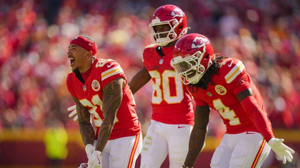 Kansas City Chiefs wide receiver Nikko Remigio (81) and wide receiver Tyquan Thornton (80) and wide receiver Rashee Rice (4) celebrate after a touchdown during the first half against the Las Vegas Raiders at GEHA Field at Arrowhead Stadium.