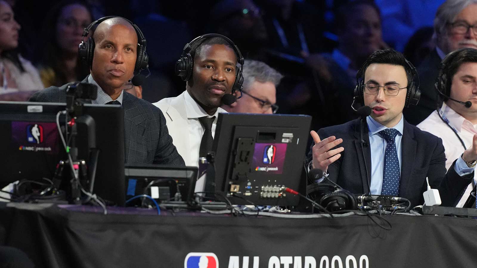NBC Peacock analysts Reggie Miller (left) and Jamal Crawford (center) and play-by-play announcer Noah Eagle watch during the 75th NBA All Star Game at Intuit Dome. 
