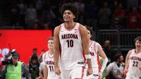 Arizona Wildcats forward Koa Peat (10) reacts after defeating the Houston Cougars during the men's Big 12 Conference Tournament Championship at T-Mobile Center.