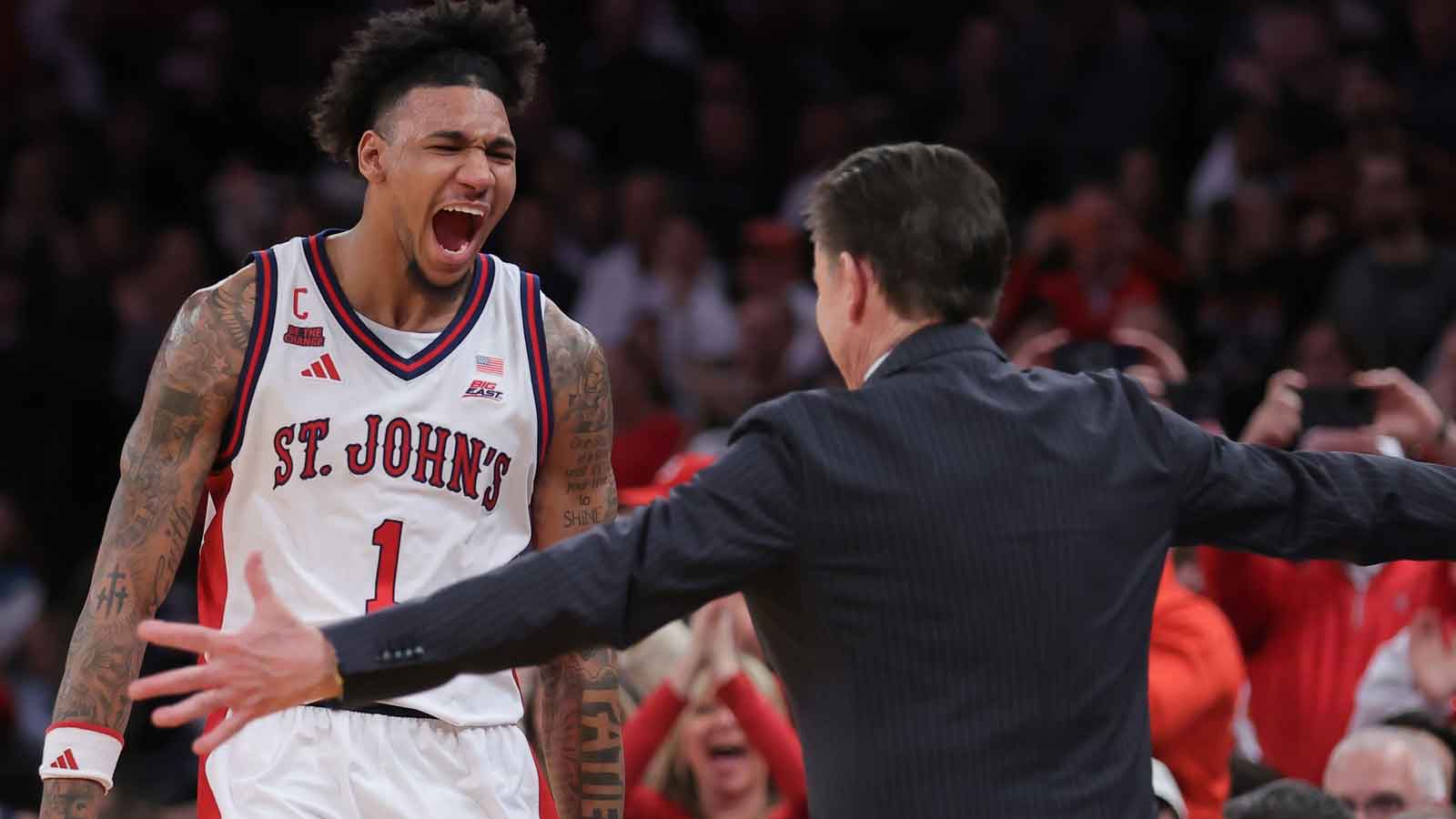 St. John's Red Storm forward Dillon Mitchell (1) with head coach Rick Pitino as he checks out of the game during the second half of the men's Big East Conference Tournament Championship against the Connecticut Huskies at Madison Square Garden.