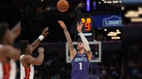 Charlotte Hornets guard LaMelo Ball (1) shoots a three point basket against the Miami Heat during the first quarter at Spectrum Center. Mandatory Credit: Jim Dedmon-Imagn Images