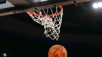A Wilson EVO Nxt basketball ball with the 2025 NCAA Women's Final Four logo approaches the rim and the net at Amalie Arena.