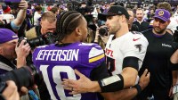 Minnesota Vikings wide receiver Justin Jefferson (18) and Atlanta Falcons quarterback Kirk Cousins (18) talk after the game at U.S. Bank Stadium.