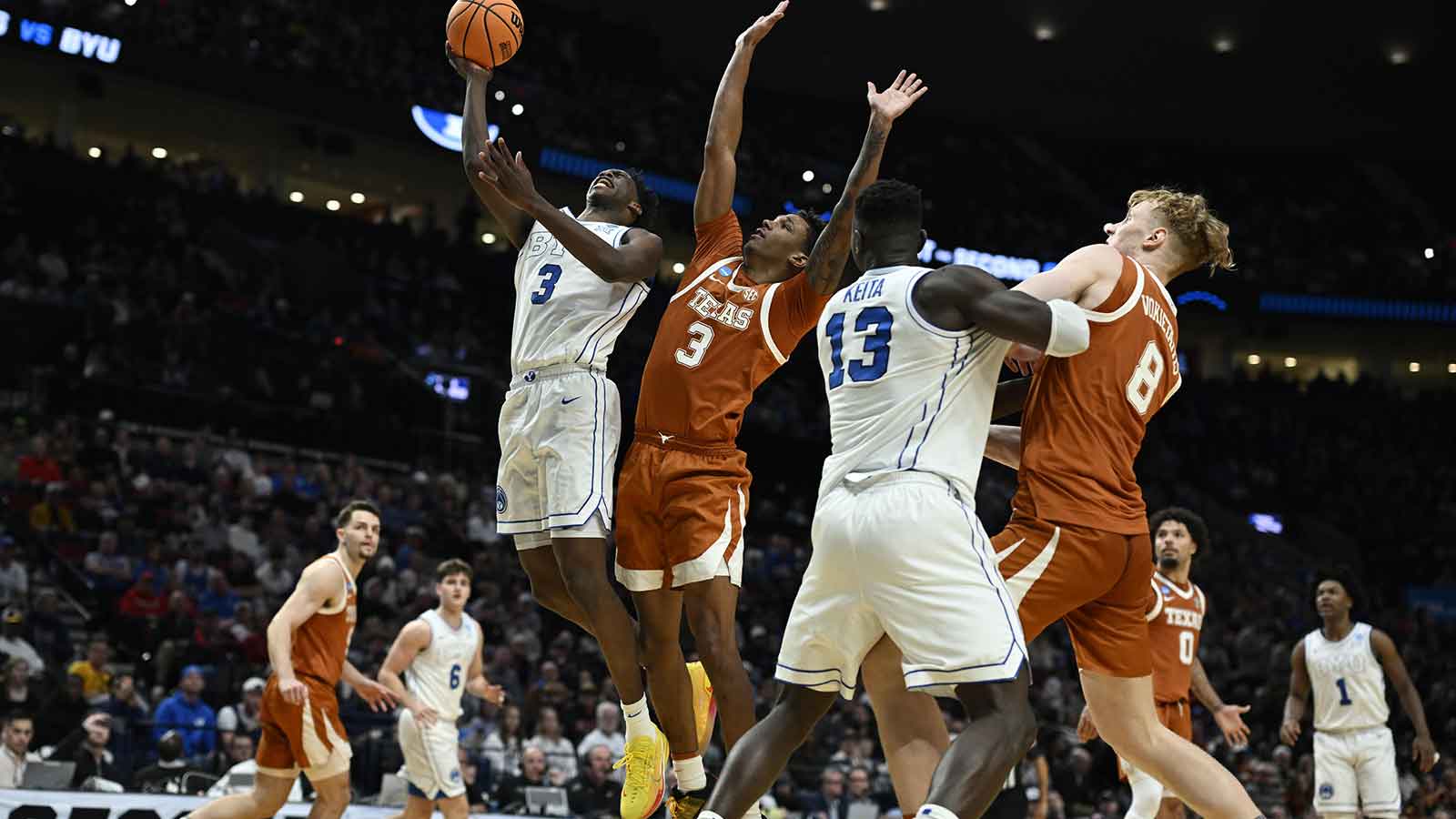 BYU Cougars forward AJ Dybantsa (3) shoots against Texas Longhorns forward Dailyn Swain (3) in the second half during a first round game of the men's 2026 NCAA Tournament at Moda Center.