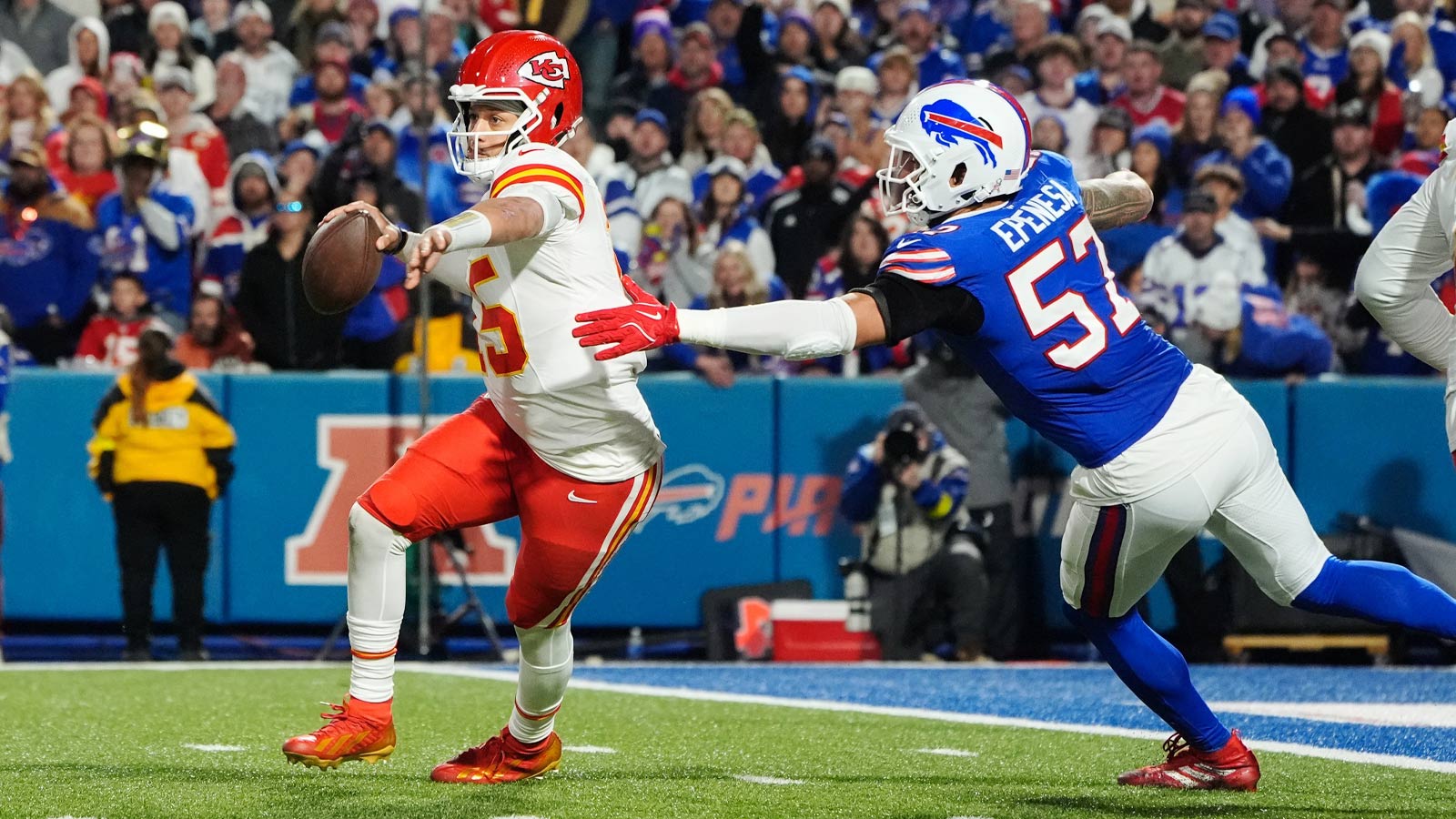 Kansas City Chiefs quarterback Patrick Mahomes (15) is pressured to throw by Buffalo Bills defensive end A.J. Epenesa (57) in the second half at Highmark Stadium. 