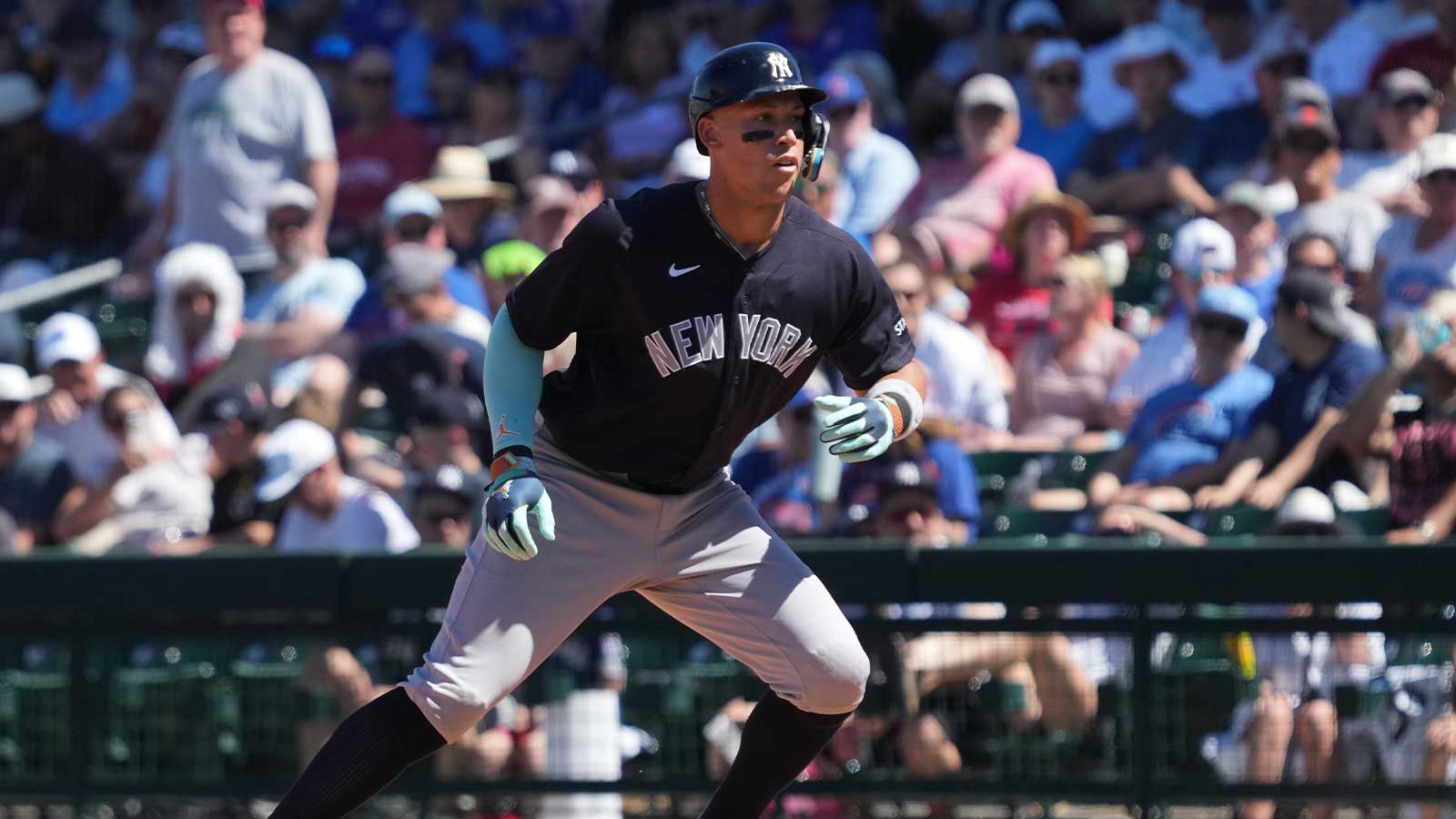 New York Yankees right fielder Aaron Judge (99) hits a single against the Chicago Cubs in the fifth inning at Sloan Park. 