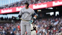 New York Yankees right fielder Aaron Judge (99) holds onto his bat after fouling off a pitch against the San Francisco Giants in the third inning at Oracle Park.
