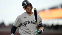 San Francisco, California, USA; New York Yankees right fielder Aaron Judge (99) looks at his bat between pitches against the San Francisco Giants in the sixth inning at Oracle Park.