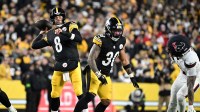 Pittsburgh Steelers quarterback Aaron Rodgers (8) throws during the first half of an AFC Wild Card Round game against the Houston Texans at Acrisure Stadium.