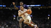 Arkansas Razorbacks guard Darius Acuff Jr. (5) drives against High Point Panthers forward Cam'ron Fletcher (11) in the second half during a second round game of the men's 2026 NCAA Tournament at Moda Center.