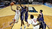 Arkansas Razorbacks guard Darius Acuff Jr. (5) shoots against High Point Panthers guard Scotty Washington (12) in the first half during a second round game of the men's 2026 NCAA Tournament at Moda Center.
