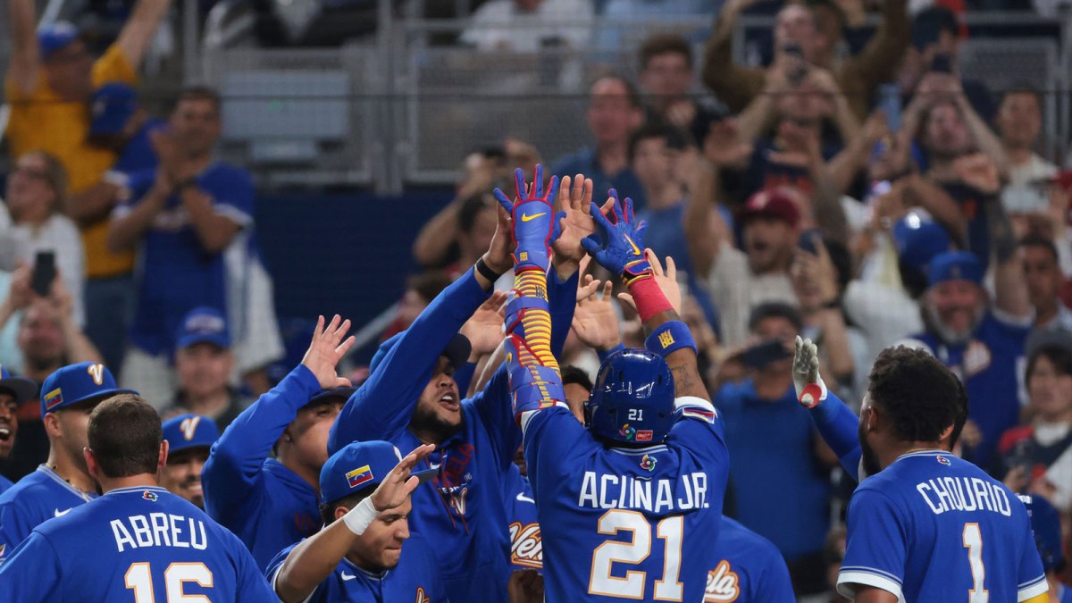 Venezuela right fielder Ronald Acuna Jr. (21) celebrates with teammates after hitting a home run against Japan in the first inning during a quarterfinal game of the 2026 World Baseball Classic at loanDepot Park.