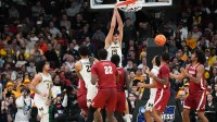 Michigan Wolverines center Aday Mara (15) dunks in the second half against the Alabama Crimson Tide during a Sweet Sixteen game of the Midwest Regional of the men's 2026 NCAA Tournament at United Center.