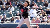 Arizona Diamondbacks' Alek Thomas (5) runs to second base after hitting a double against the Colorado Rockies in the second inning during a spring training game at Salt River Fields.