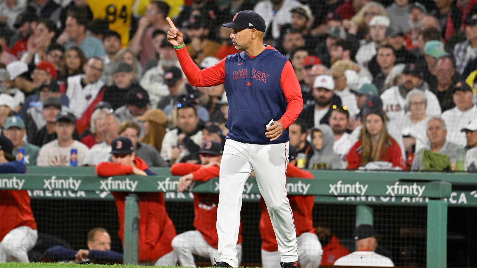 Boston Red Sox manager Alex Cora (21) signals to the bullpen during the fifth inning against the Athletics at Fenway Park. 