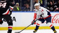 Buffalo Sabres defenseman Logan Stanley (64) looks to block a shot by Washington Capitals left wing Alex Ovechkin (8) during the first period at KeyBank Center.