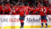 Washington Capitals left wing Alex Ovechkin (8) celebrates with teammates after scoring a goal during the second period against the Ottawa Senators at Capital One Arena.
