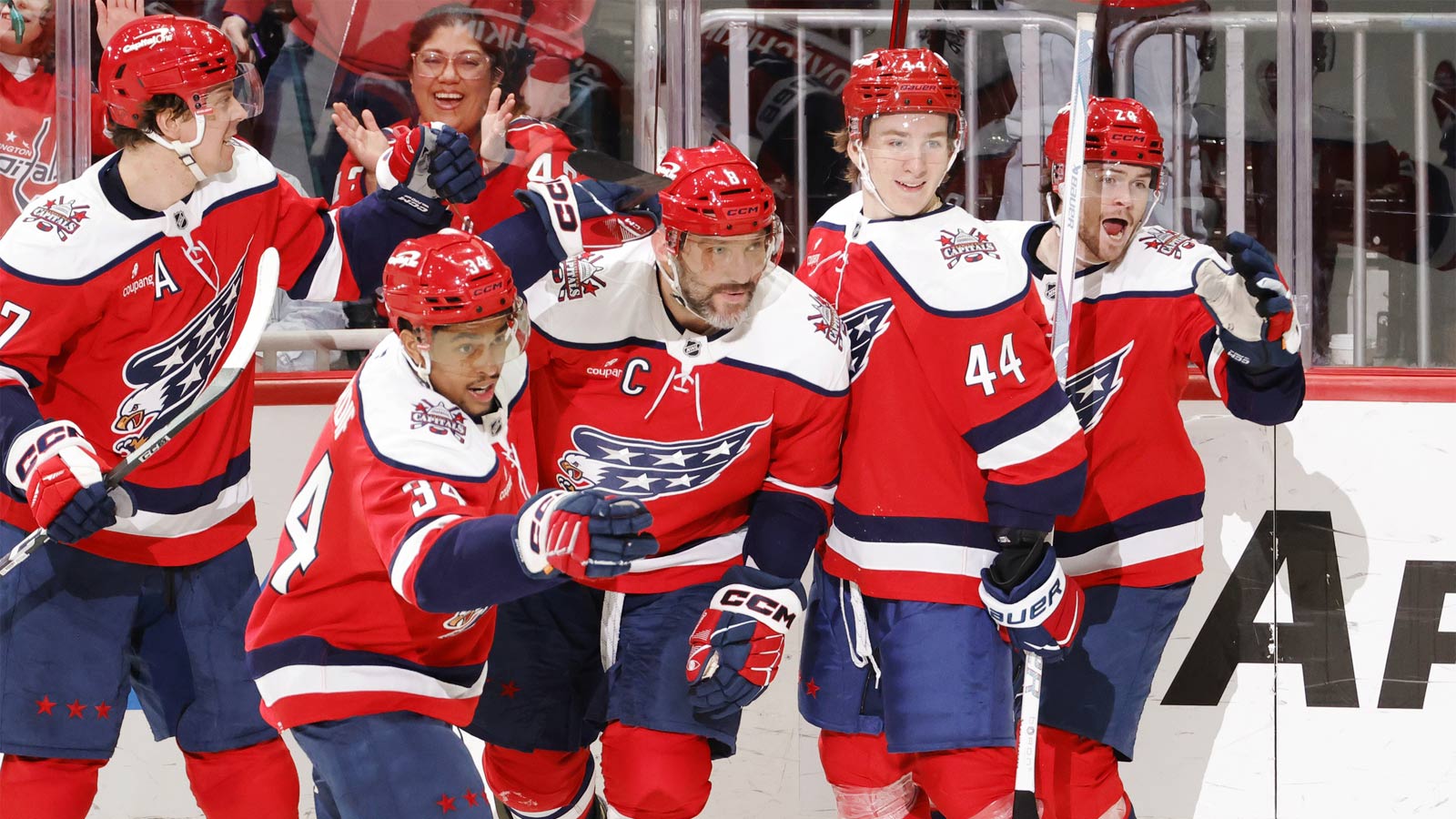 Washington Capitals left wing Alex Ovechkin (8) celebrates with teammates after scoring his 1,000th career goal in regular season and playoffs combined against the Colorado Avalanche at Capital One Arena.