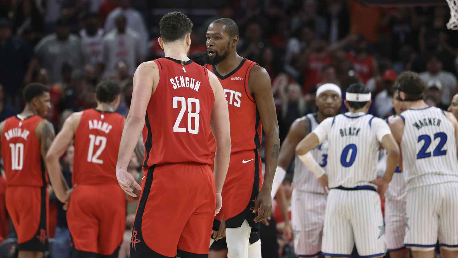 Houston Rockets center Alperen Sengun (28) reacts with forward Kevin Durant (7) after making a basket during overtime against the Orlando Magic at Toyota Center.