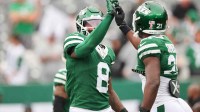 New York Jets safety Andre Cisco (8) and New York Jets cornerback Brandon Stephens (21) warm up before the game against the Pittsburgh Steelers at MetLife Stadium.