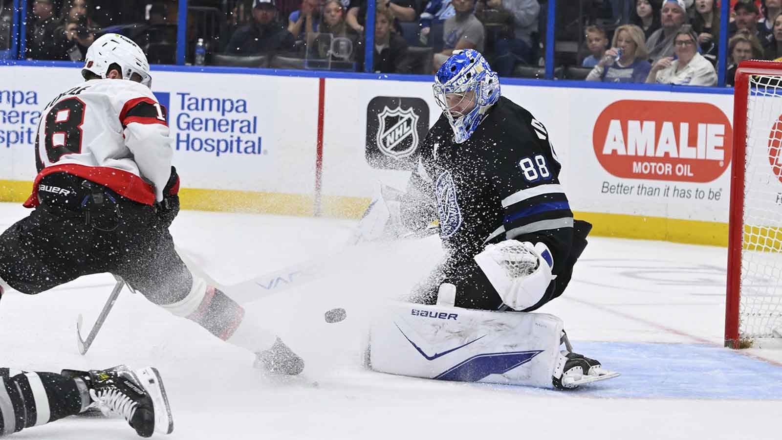 Tampa Bay Lightning goalie Andrei Vasilevskiy (88) blocks a shot from Ottawa Senators center Tim Stutzle (18) during the second period at Benchmark International Arena. 