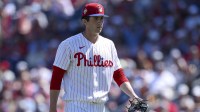 Philadelphia Phillies starting pitcher Andrew Painter (76) walks off the field after pitching against the New York Yankees in the first inning during spring training at BayCare Ballpark.