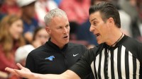 Southern Methodist University Mustangs head coach Andy Enfield (left) argues with a referee during the second half against the Stanford Cardinal at Maples Pavilion.