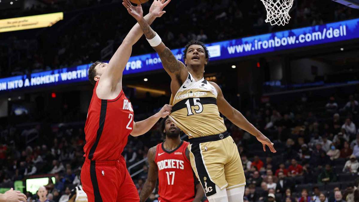 Washington Wizards forward Julian Reese (15) and and Houston Rockets center Alperen Sengun (28) battle for a rebound in the first half at Capital One Arena.