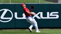 Los Angeles Angels right fielder Mike Trout (27) tracks the flight of a pop fly in the first inning against the Chicago Cubs at Tempe Diablo Stadium.