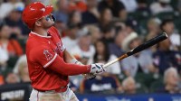 Los Angeles Angels right fielder Mike Trout (27) hits a home run against the Houston Astros in the seventh inning at Daikin Park.