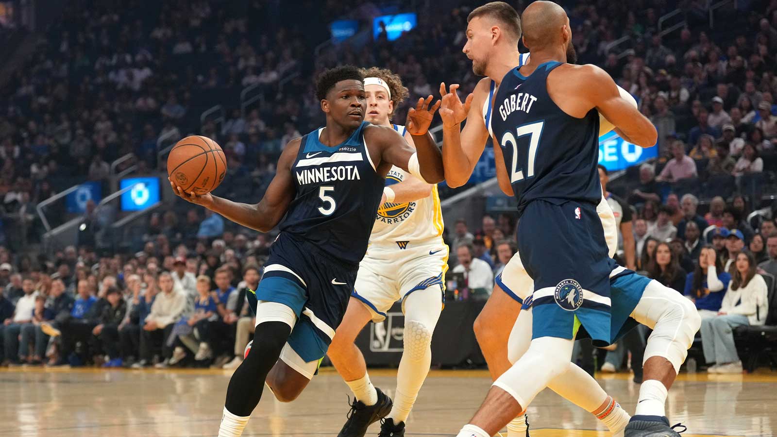 Minnesota Timberwolves guard Anthony Edwards (5) drives to the hoop against the Golden State Warriors in the first quarter at the Chase Center.