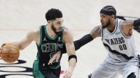 Boston Celtics small forward Jayson Tatum (0) dribbles the ball while defended by Portland Trail Blazers power forward Carmelo Anthony (00) during the second half at Moda Center.