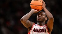 Arizona Wildcats guard Jaden Bradley (0) shoots the ball against the Purdue Boilermakers in the first half during an Elite Eight game of the West Regional of the men's 2026 NCAA Tournament at SAP Center