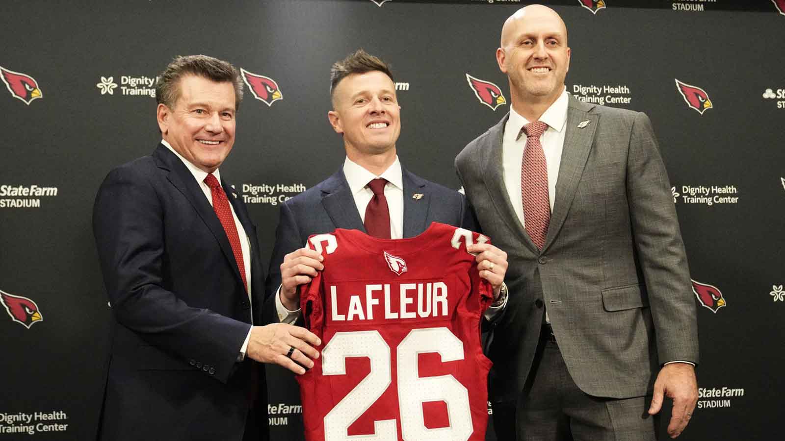 Arizona Cardinals president Michael Bidwill, new head coach Mike LaFleur, and general manager Monti Ossenfort pose for a photograph on Feb. 3, 2026, at Arizona Cardinals training center in Tempe.