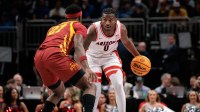 Arizona Wildcats guard Jaden Bradley (0) brings the ball up court around Iowa State Cyclones guard Killyan Toure (27) during the first half at T-Mobile Center.