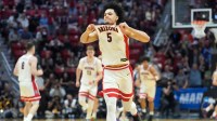 Arizona Wildcats guard Brayden Burries (5) reacts in the second half against the Utah State Aggies during a second round game of the men's 2026 NCAA Tournament at Viejas Arena.