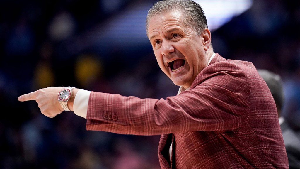 Arkansas coach John Calipari works with his team during the second half of a SEC tournament semifinal game.